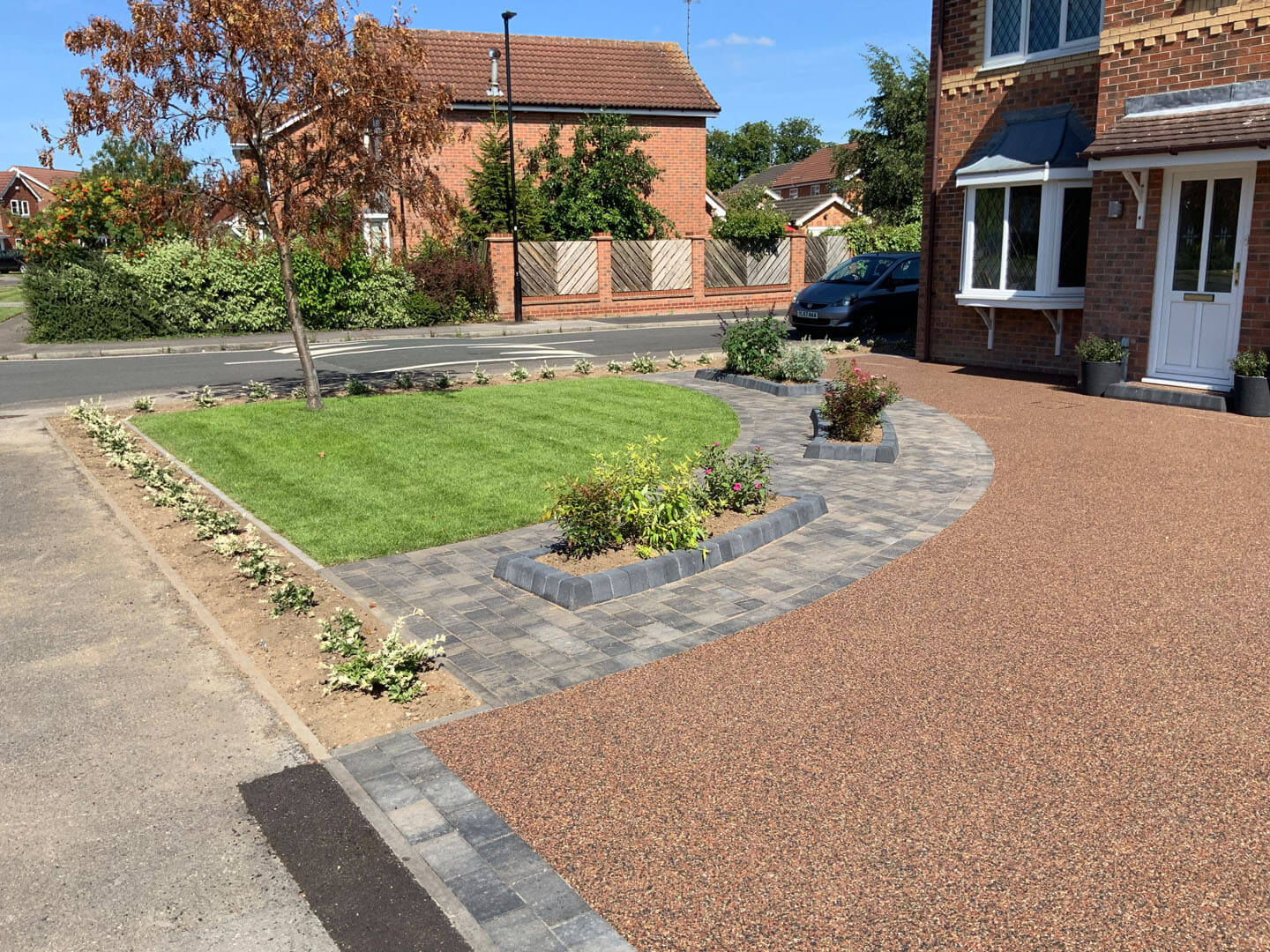 Resin driveway front of house
